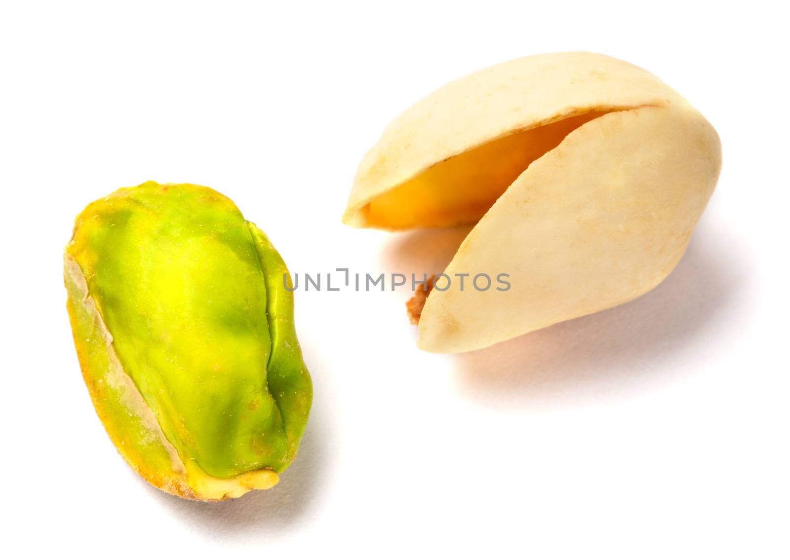 Some Pistachio nuts on a white background