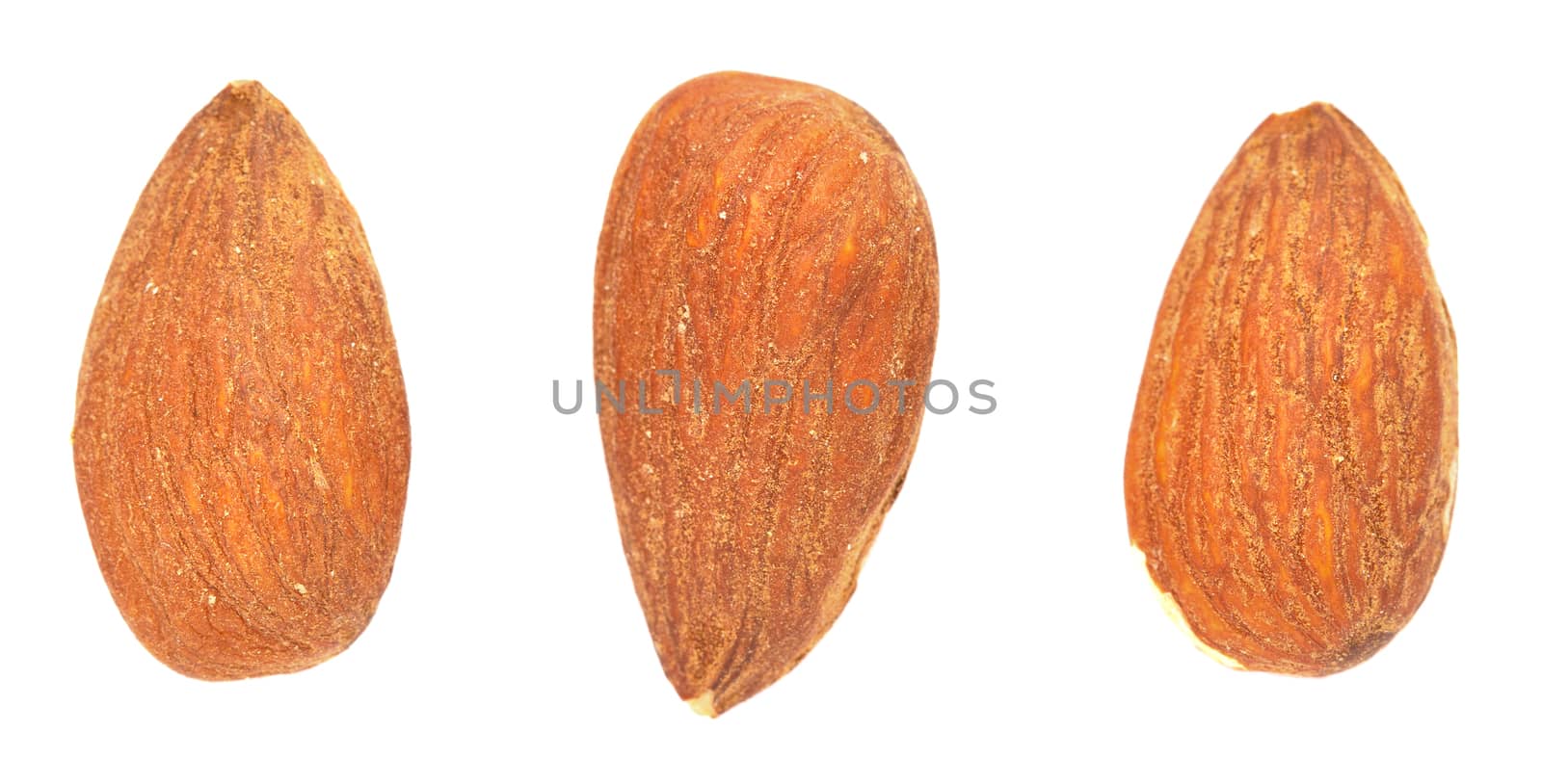 Three Almond kernels on a white background