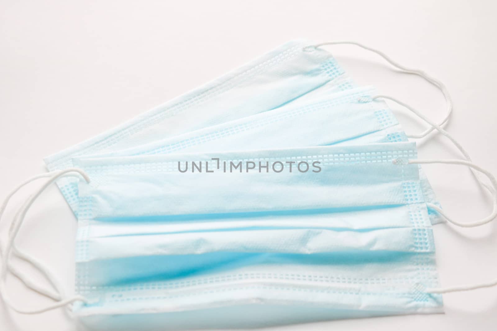 Protective surgical masks isolated in white background. by kip02kas