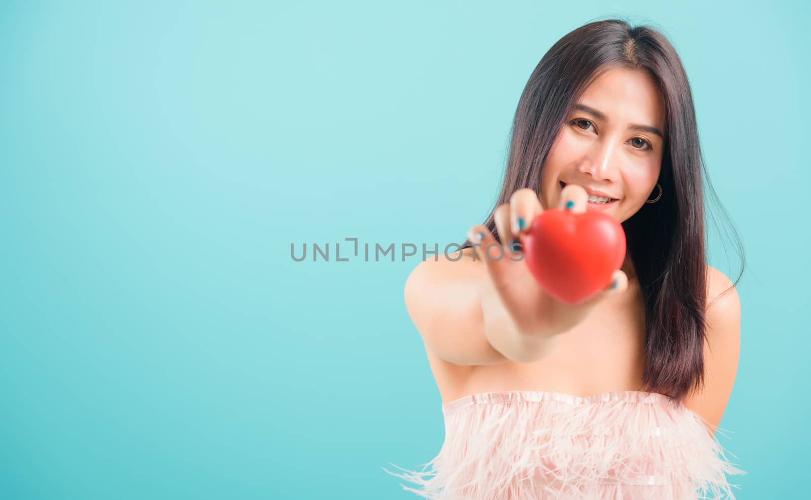 Portrait asian beautiful woman smiling her Stick out red heart o by Sorapop