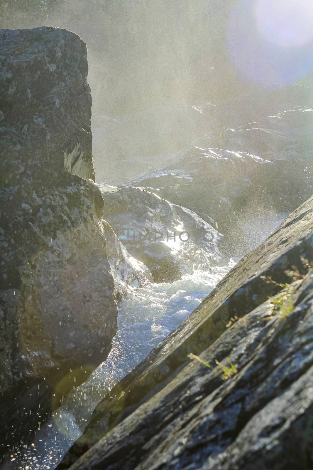 Flowing river water of the waterfall Rjukandefossen, Hemsedal, Norway. by Arkadij