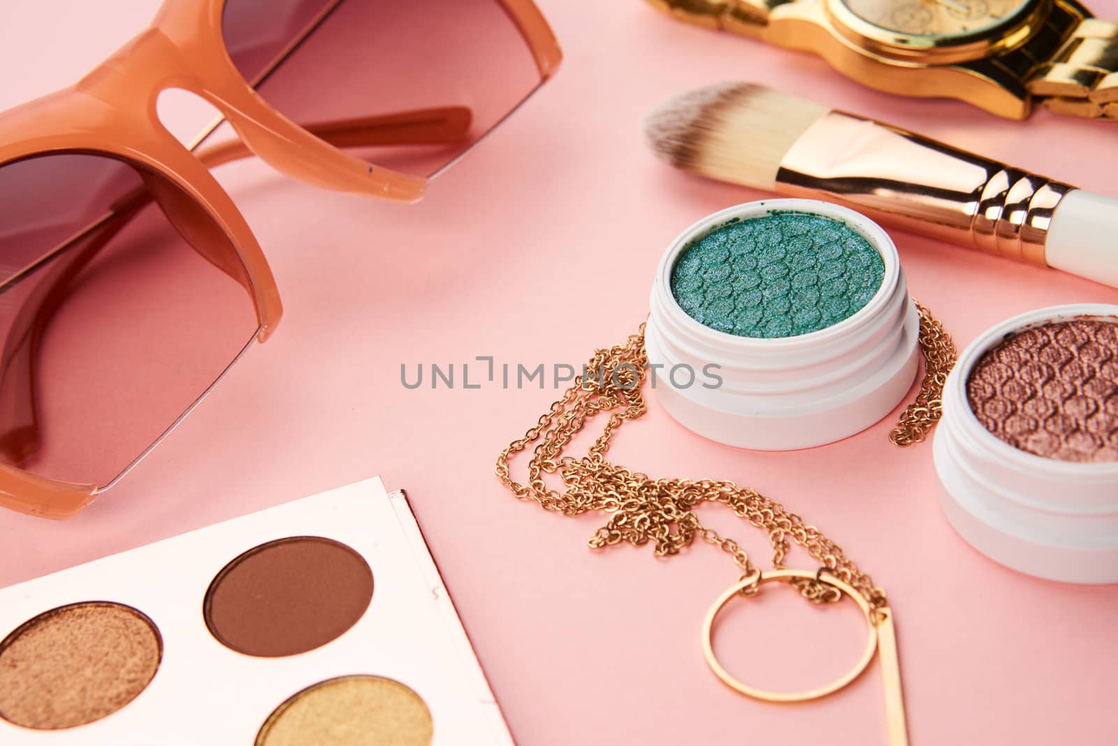 eyeshadow accessories beads makeup brushes collection professional cosmetics on pink background. High quality photo