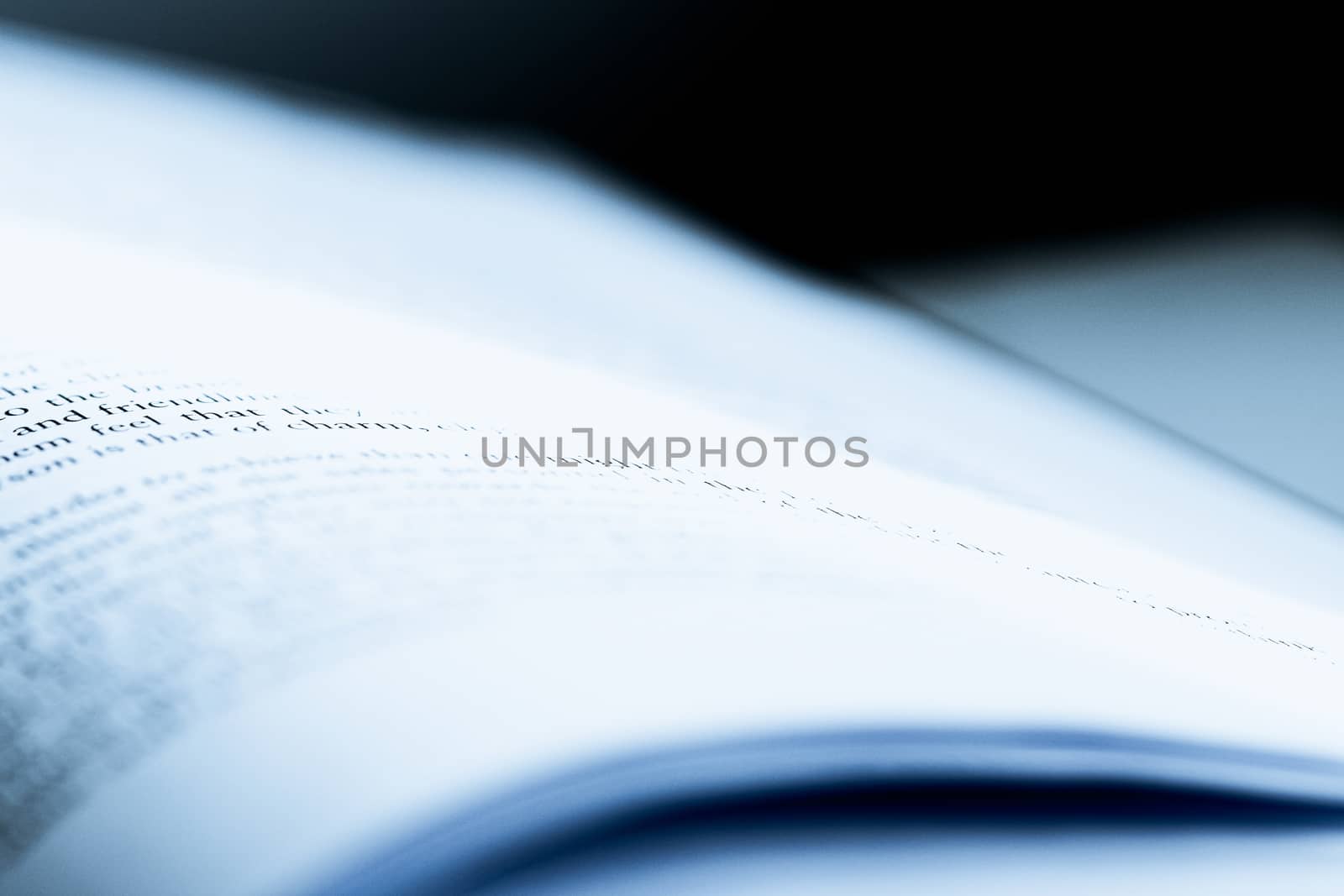 Blue toned macro closeup of an open book, education and study by Anneleven