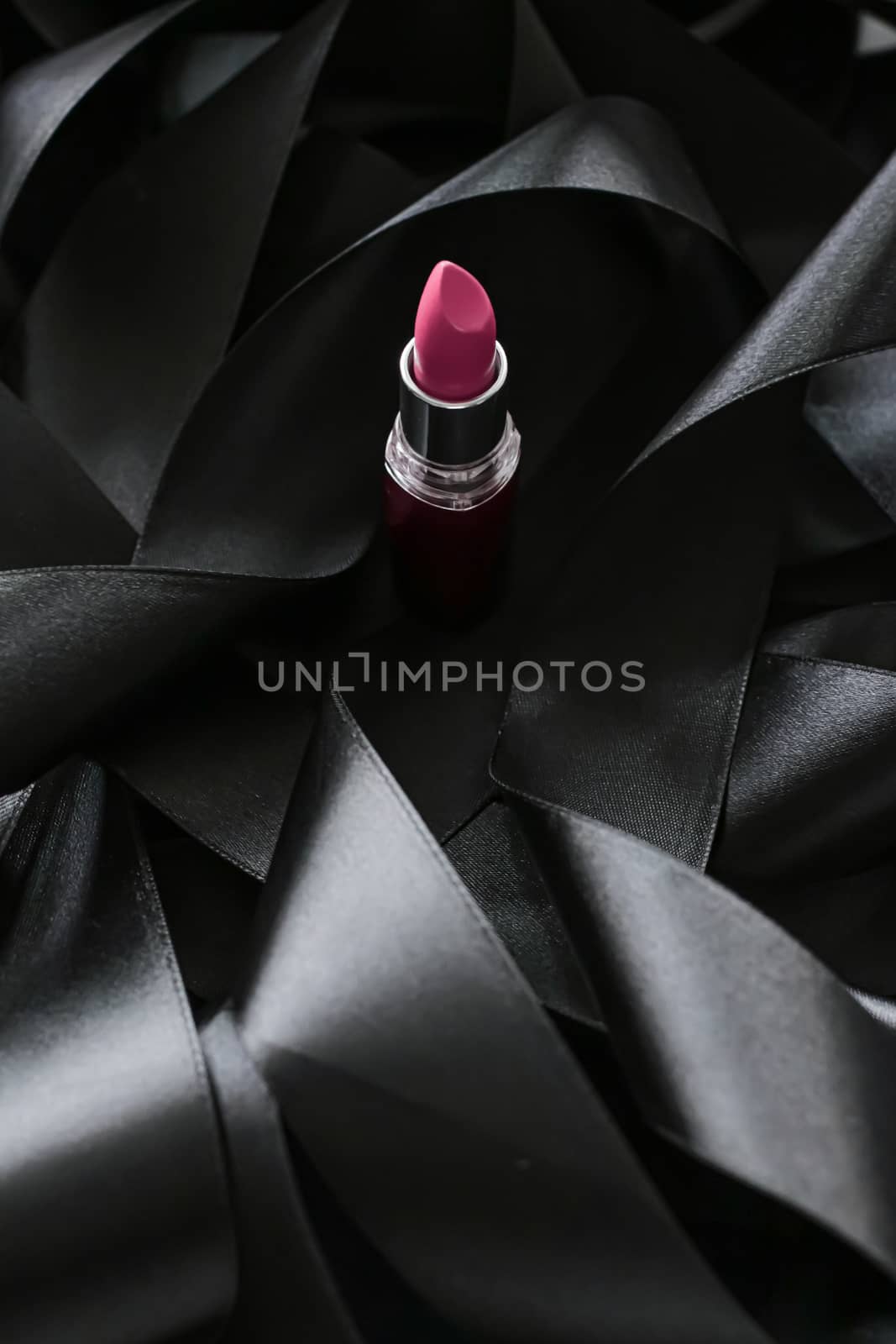 Pink lipstick on black silk background, luxury make-up and beaut by Anneleven