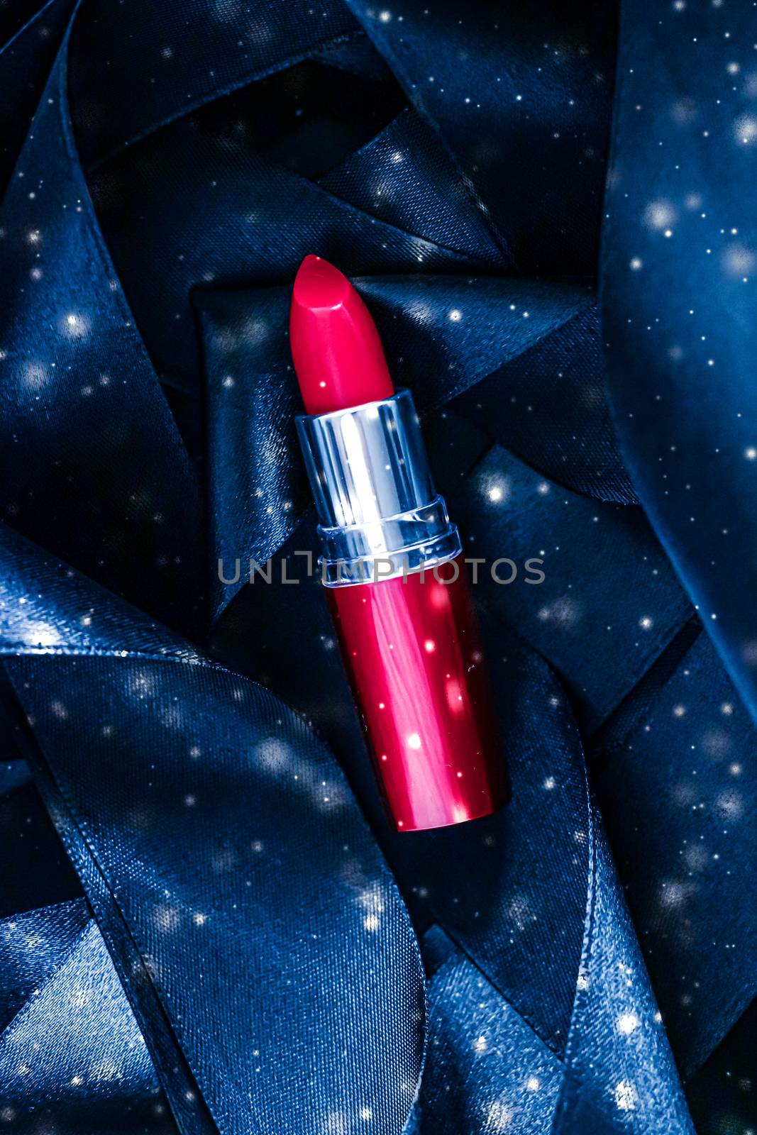 Red lipstick on blue silk and shiny glitter background, luxury m by Anneleven