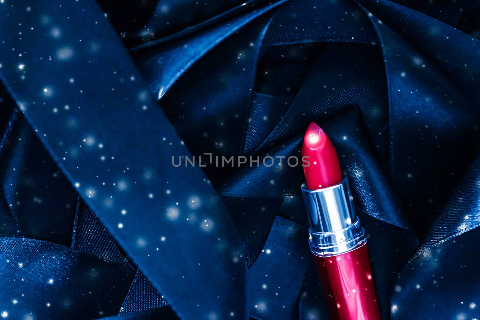 Red lipstick on blue silk and shiny glitter background, luxury m by Anneleven