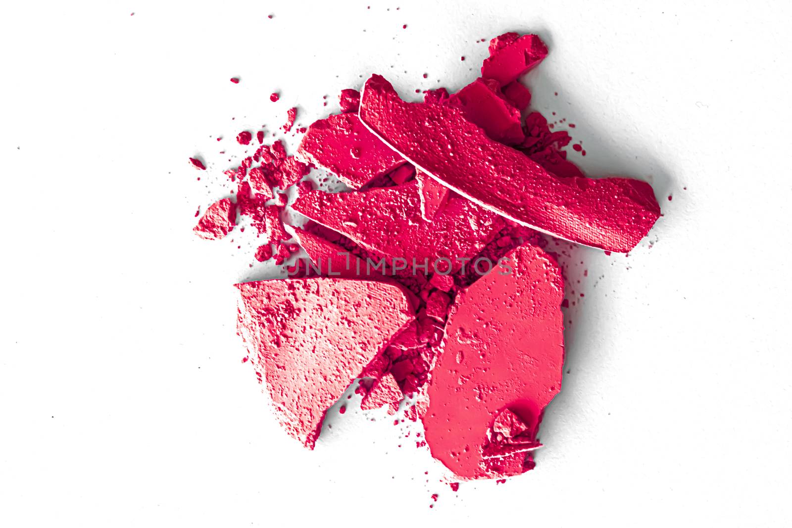 Pink eye shadow powder as makeup palette closeup isolated on white background, crushed cosmetics and beauty textures