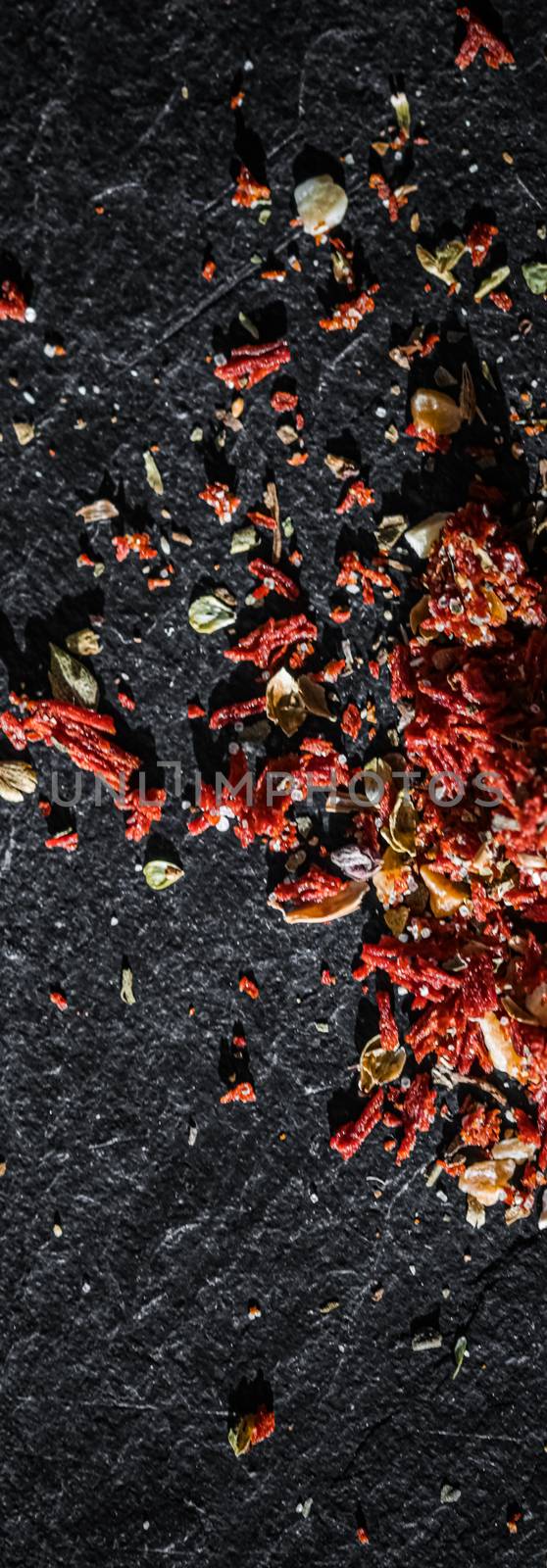 Dried tomato and chili pepper closeup on luxury stone background as flat lay, dry food spices and recipe ingredients