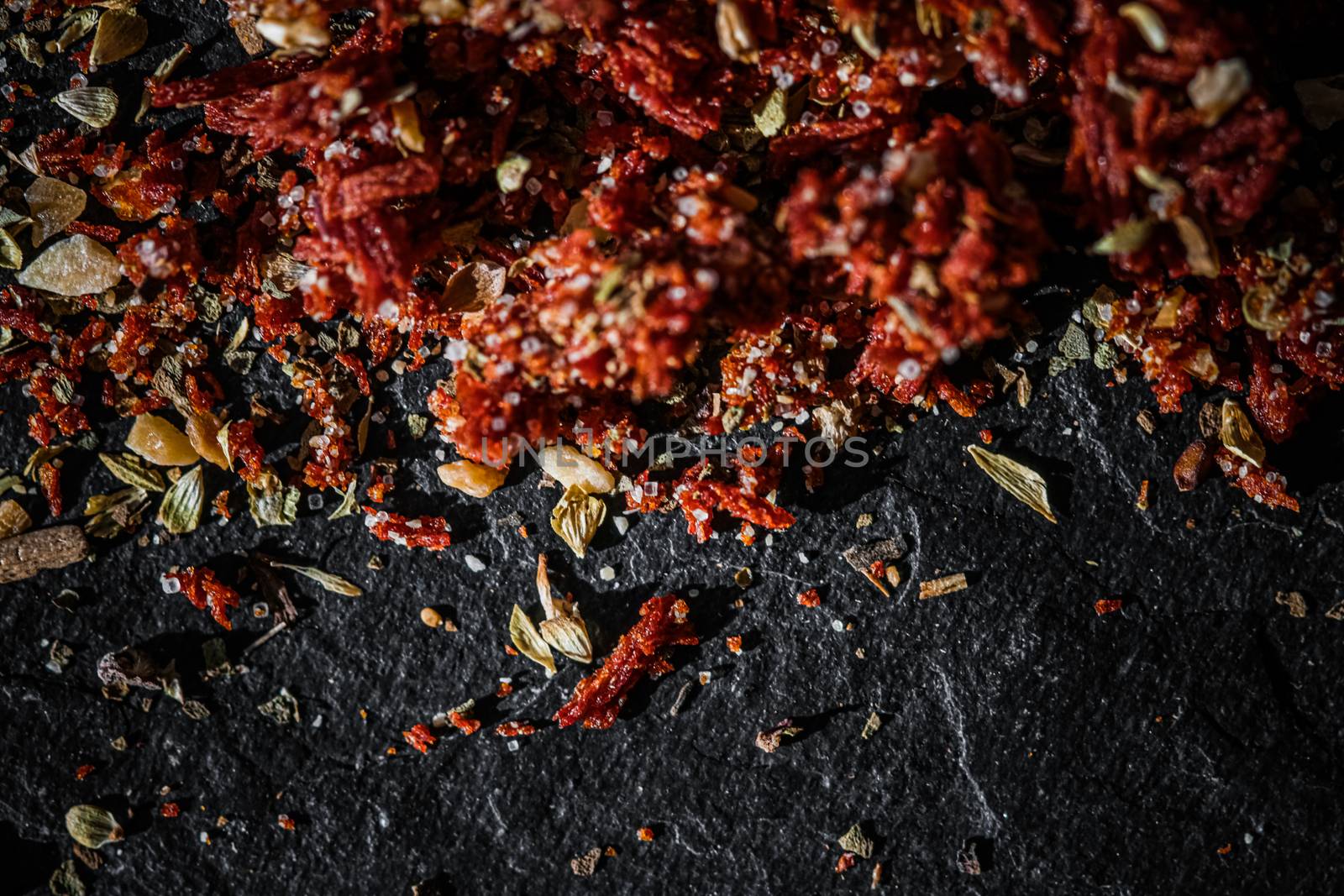 Dried tomato and chili pepper closeup on luxury stone background as flat lay, dry food spices and recipe ingredients