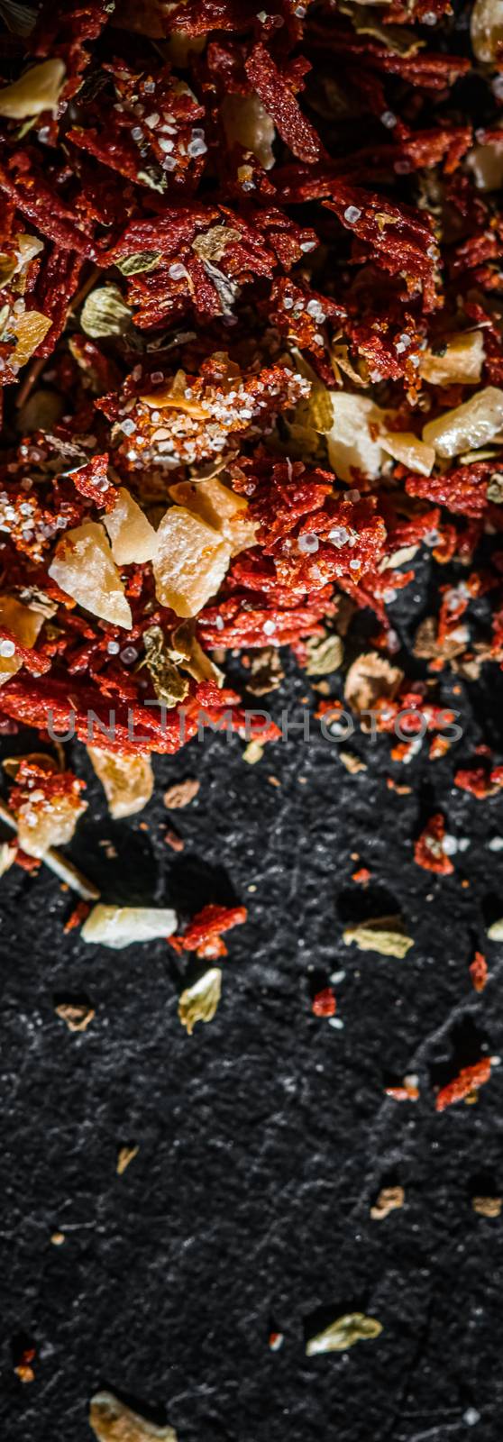 Dried tomato and chili pepper closeup on luxury stone background as flat lay, dry food spices and recipe ingredients