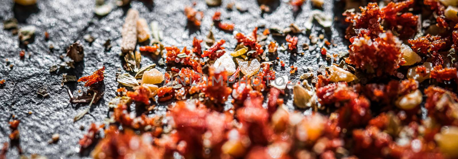 Dried tomato and chili pepper closeup on luxury stone background as flat lay, dry food spices and recipe ingredients