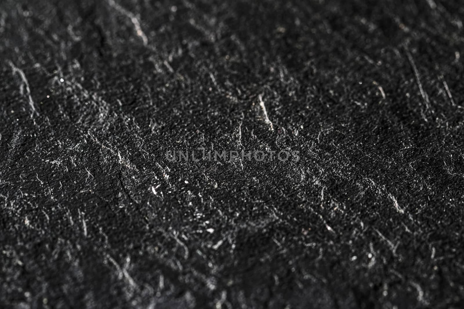 Black stone texture as abstract background, design material and textured surfaces