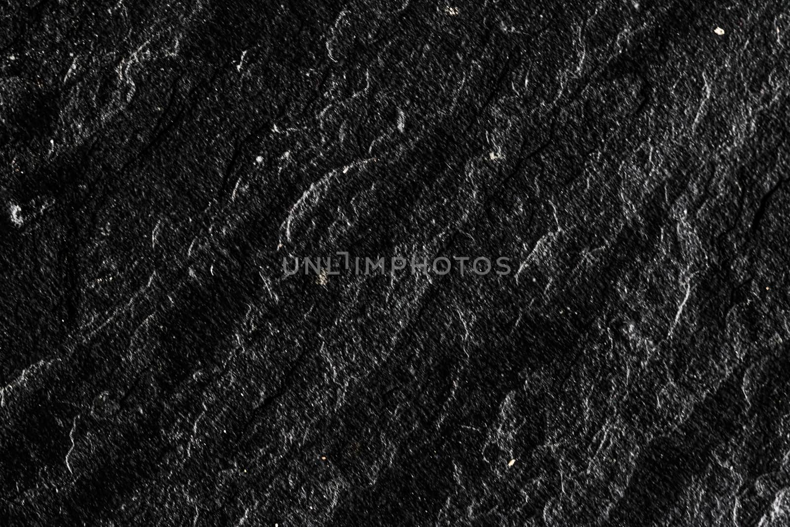 Black stone texture as abstract background, design material and textured surfaces