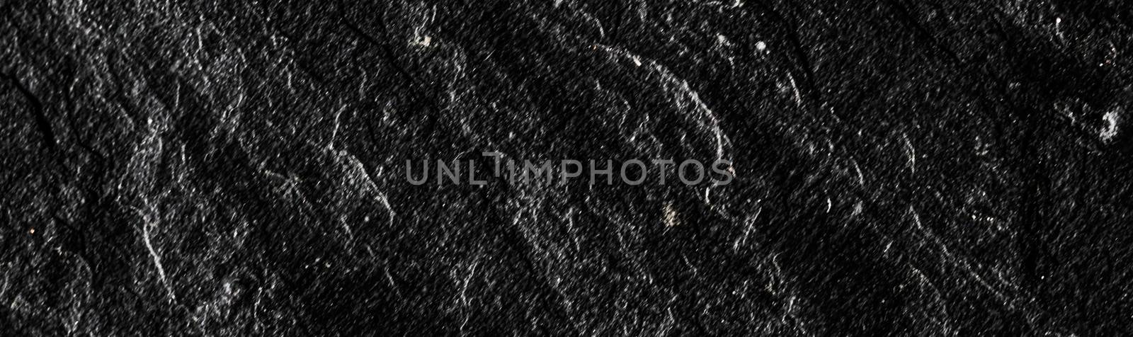 Black stone texture as abstract background, design material and textured surfaces