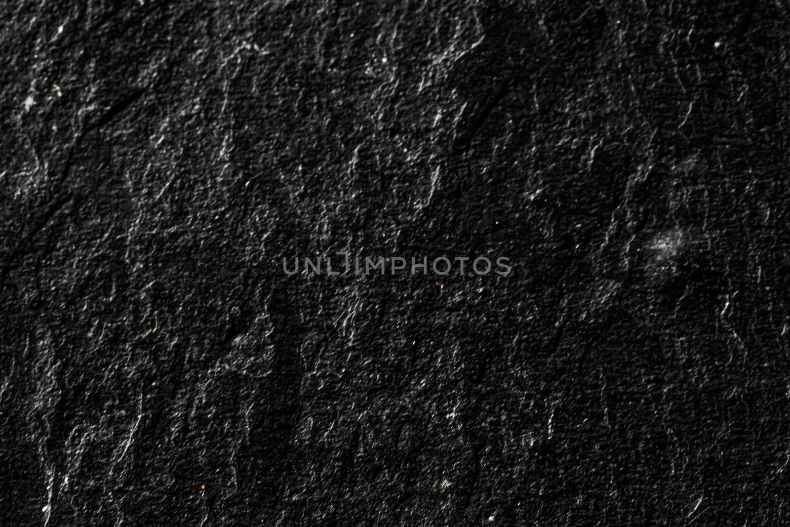 Black stone texture as abstract background, design material and textured surfaces