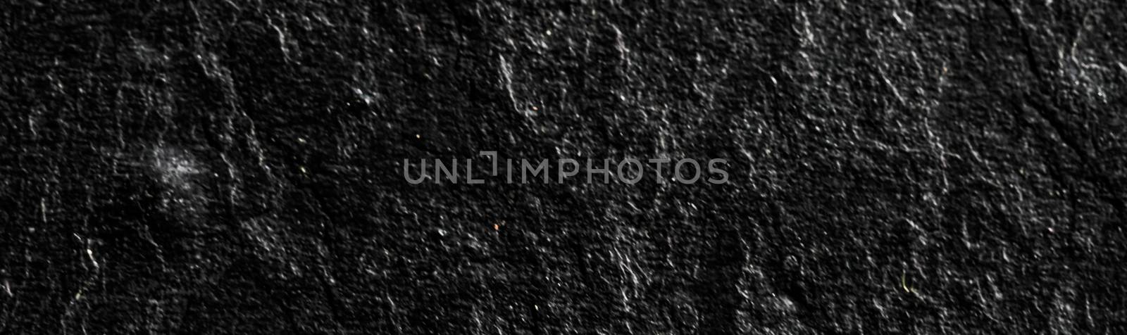 Black stone texture as abstract background, design material and textured surfaces