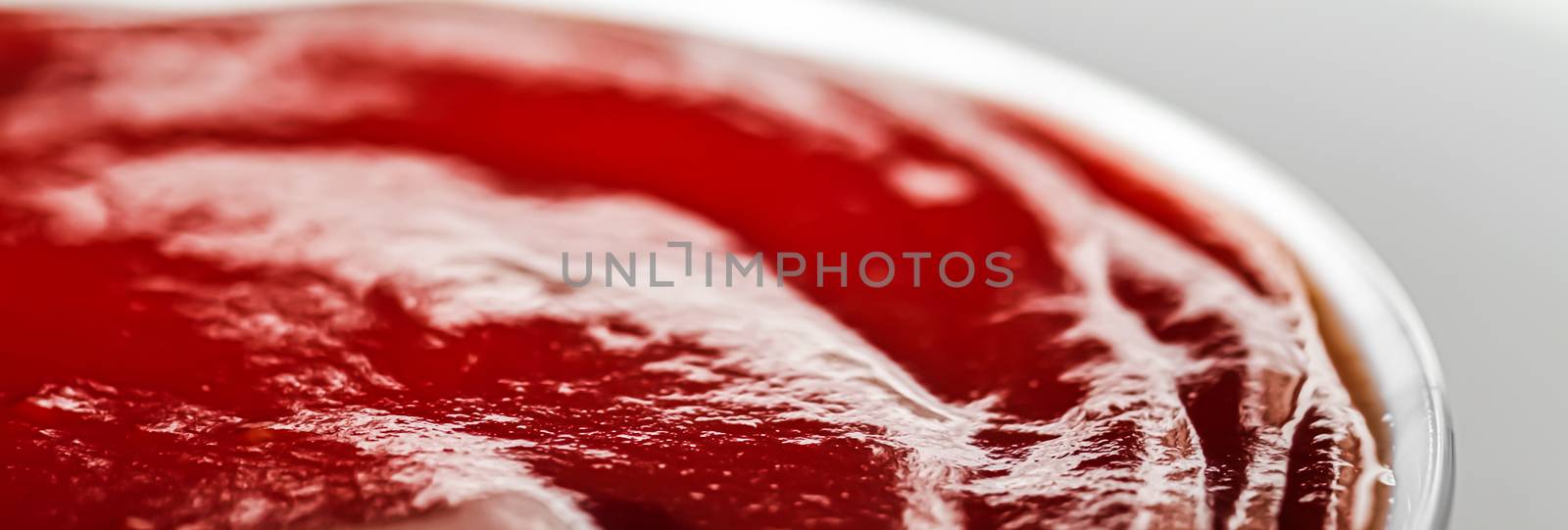 Organic ketchup, tomato sauce closeup, food background and homem by Anneleven