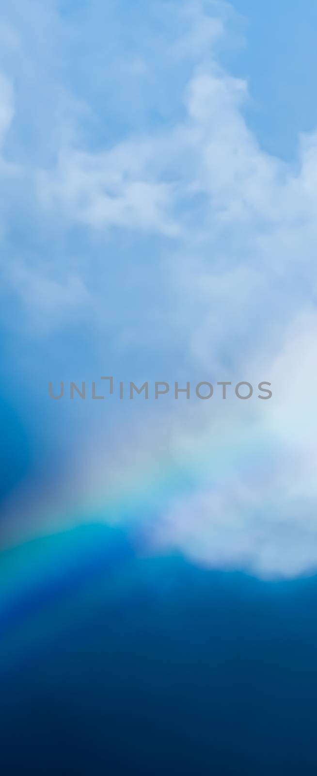 Rainbow in a dreamy blue sky, spiritual and nature backgrounds