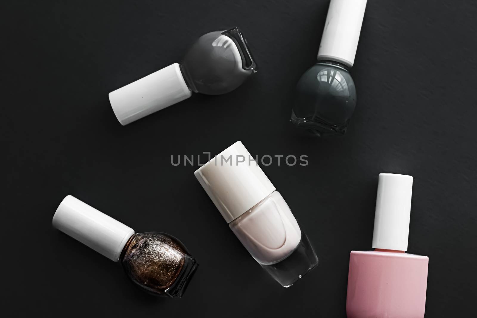 Nail polish bottles on black background, beauty brand by Anneleven