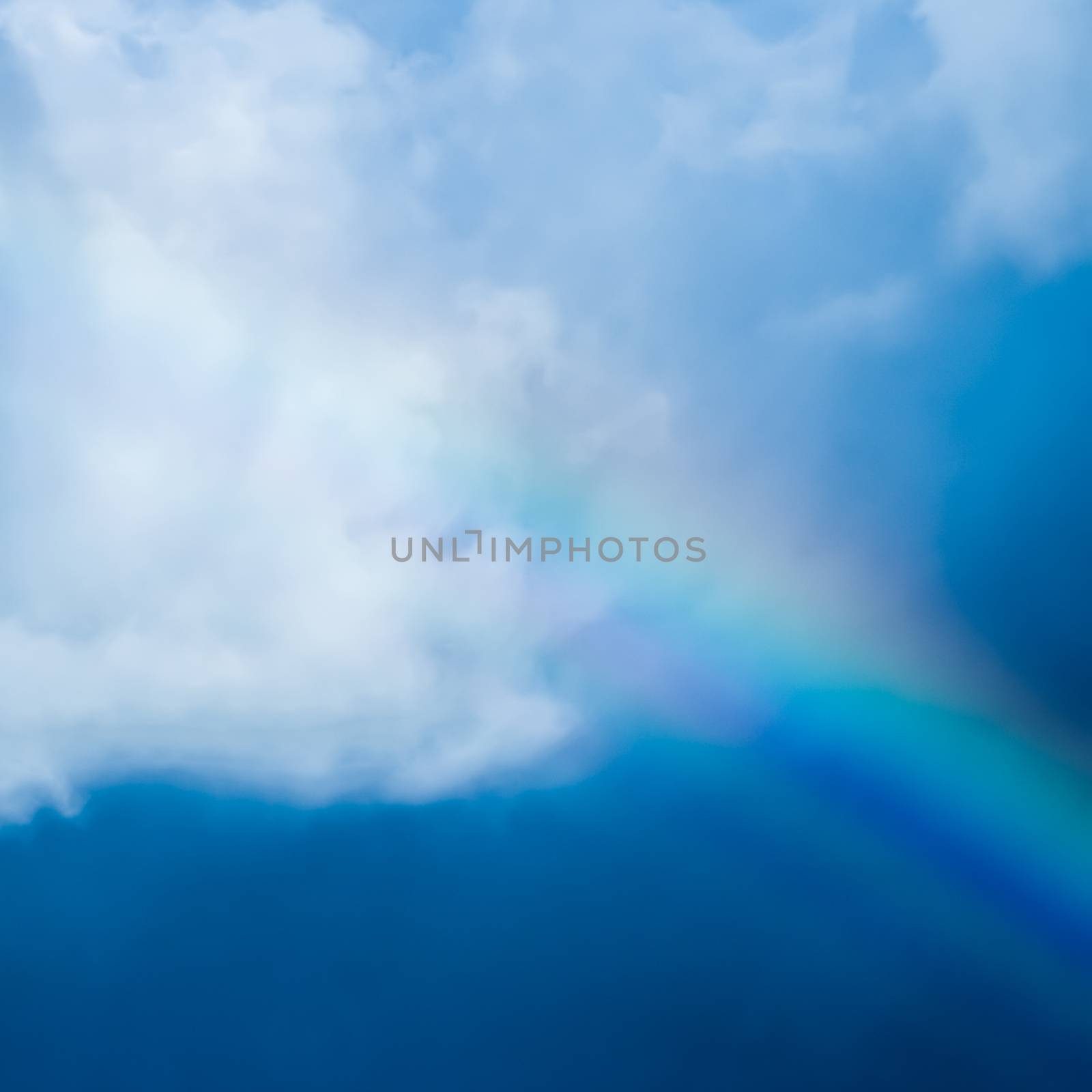 Rainbow in a dreamy blue sky, spiritual and nature backgrounds