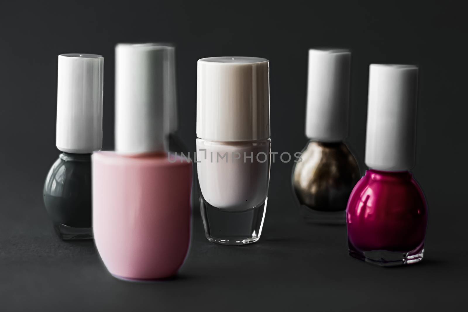 Nail polish bottles on black background, beauty brand by Anneleven