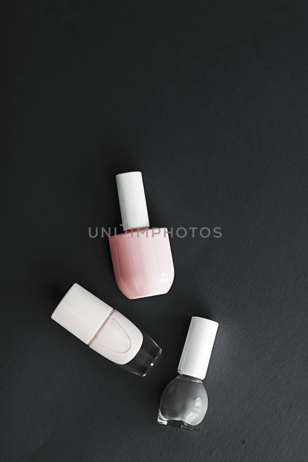 Nail polish bottles on black background, beauty brand by Anneleven