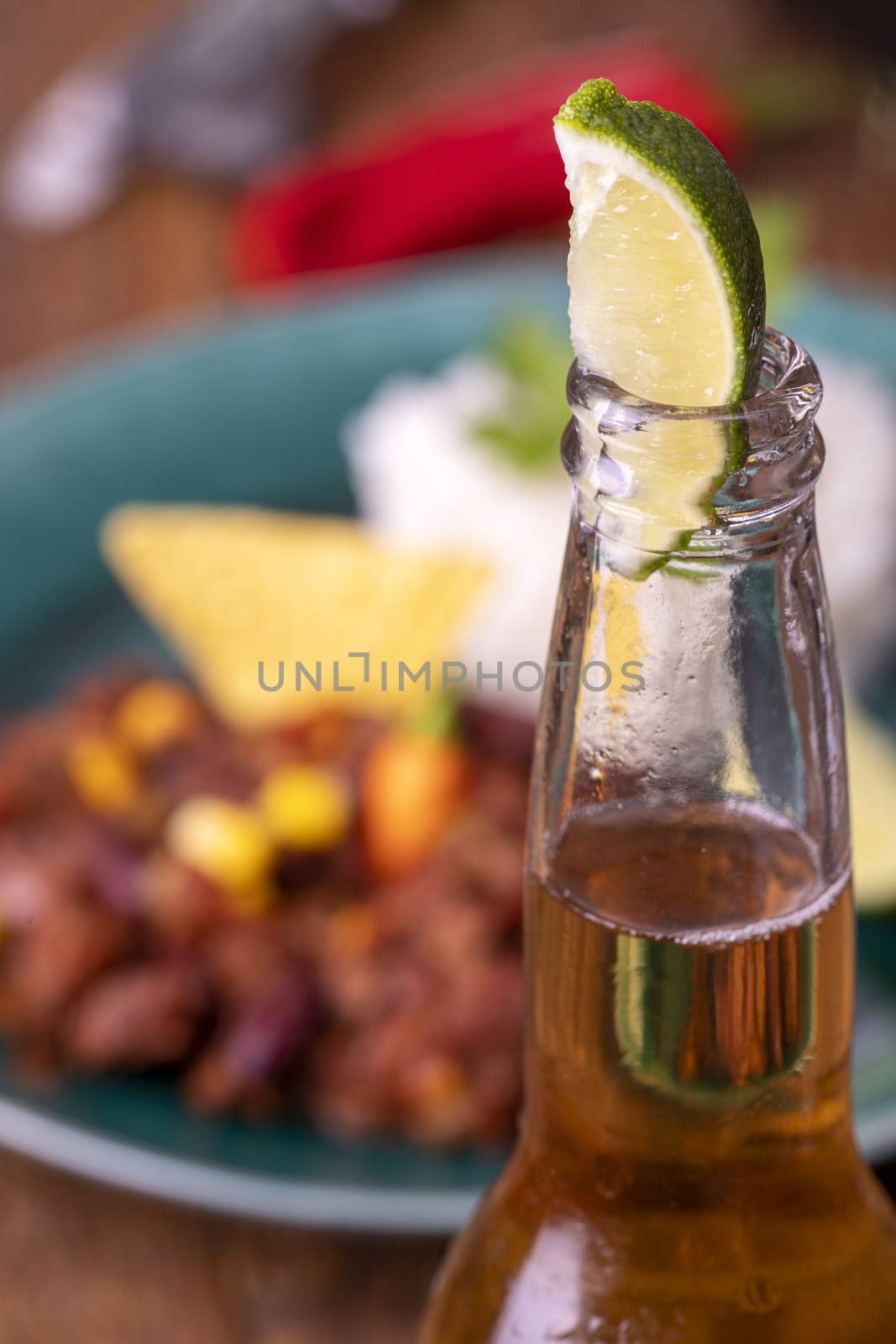 tasty chili con carne on wood