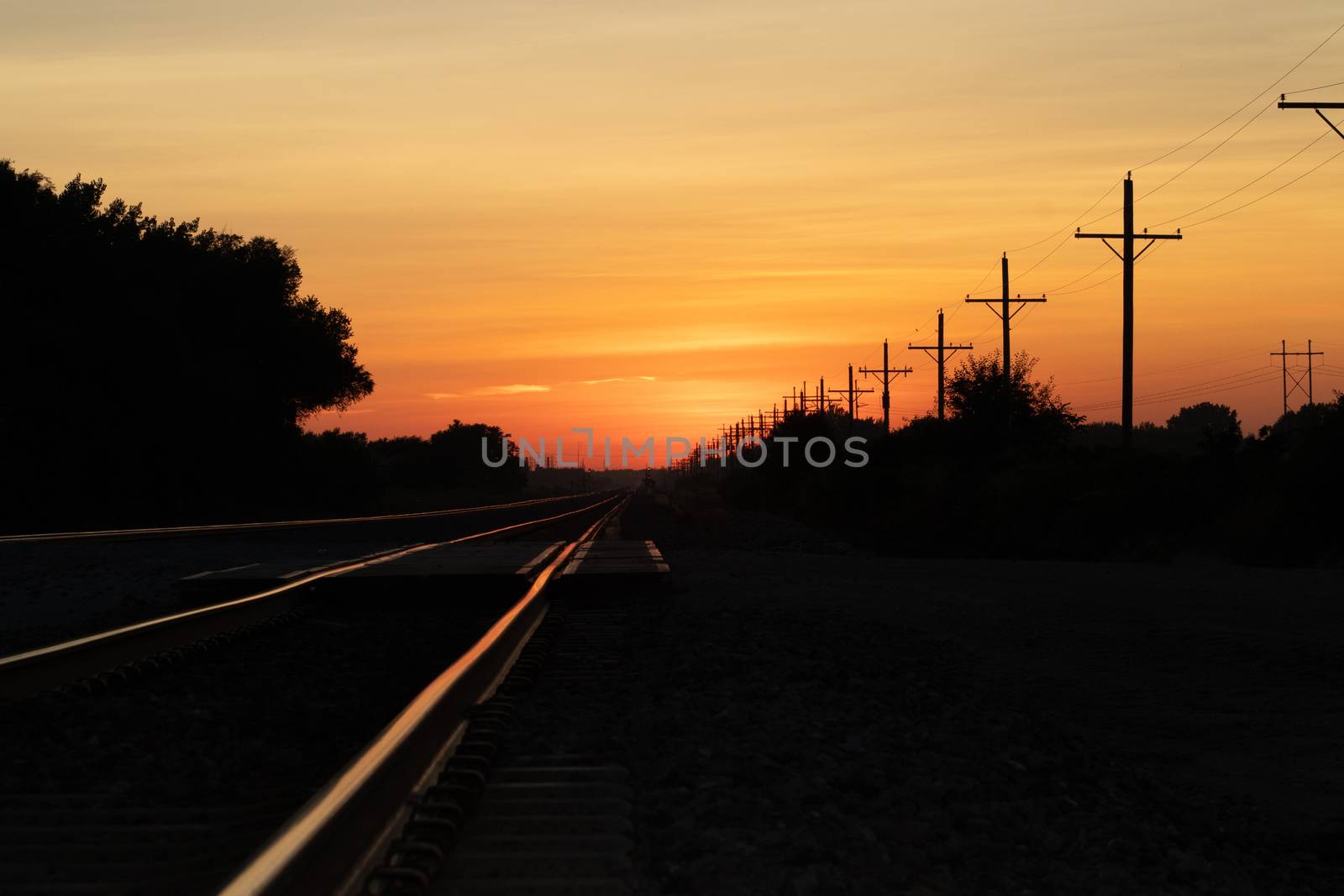 Rail Road crossing and tracks at sunset  by gena_wells