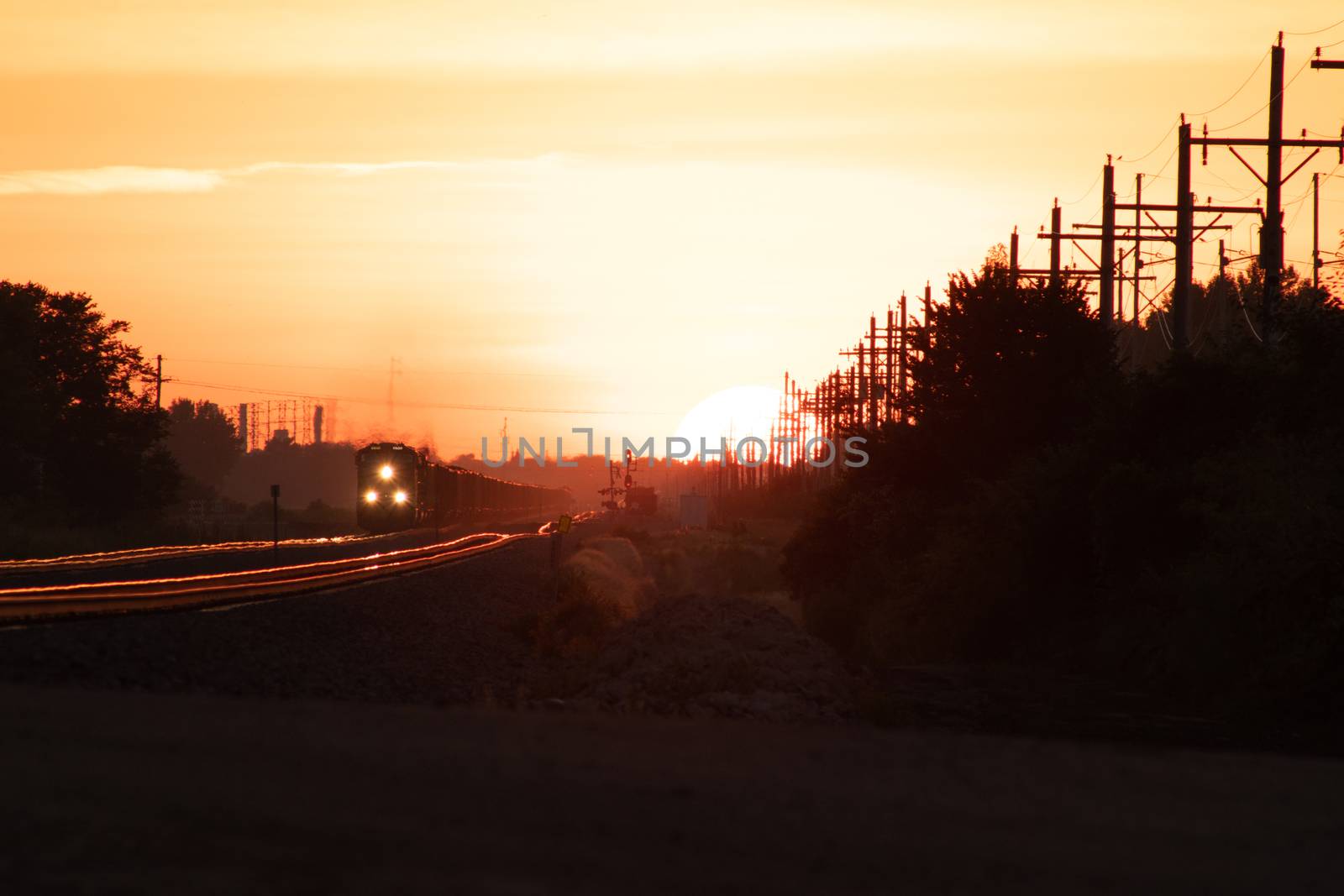 Rail Road crossing and tracks at sunset by gena_wells