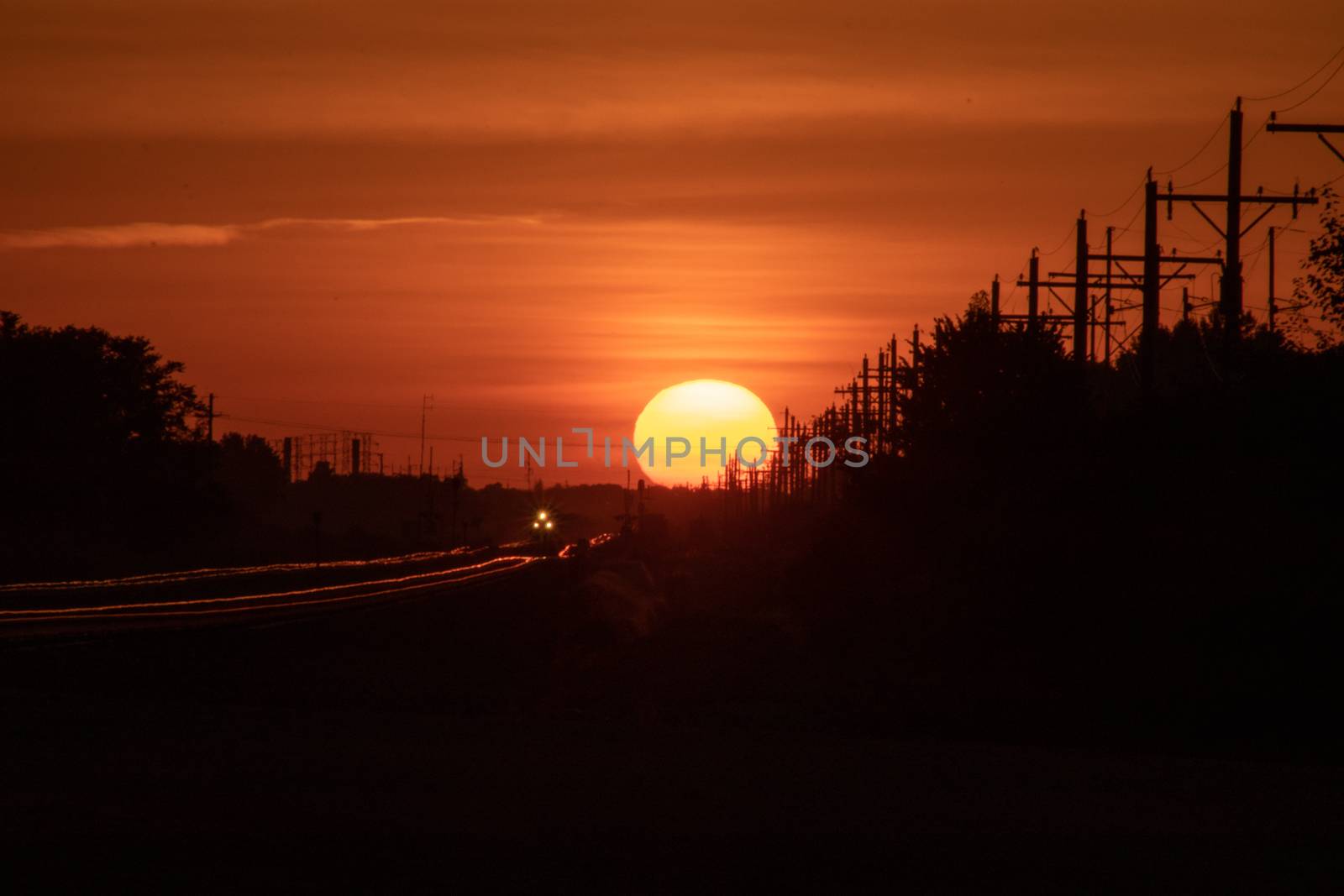 Rail Road crossing and tracks at sunset by gena_wells