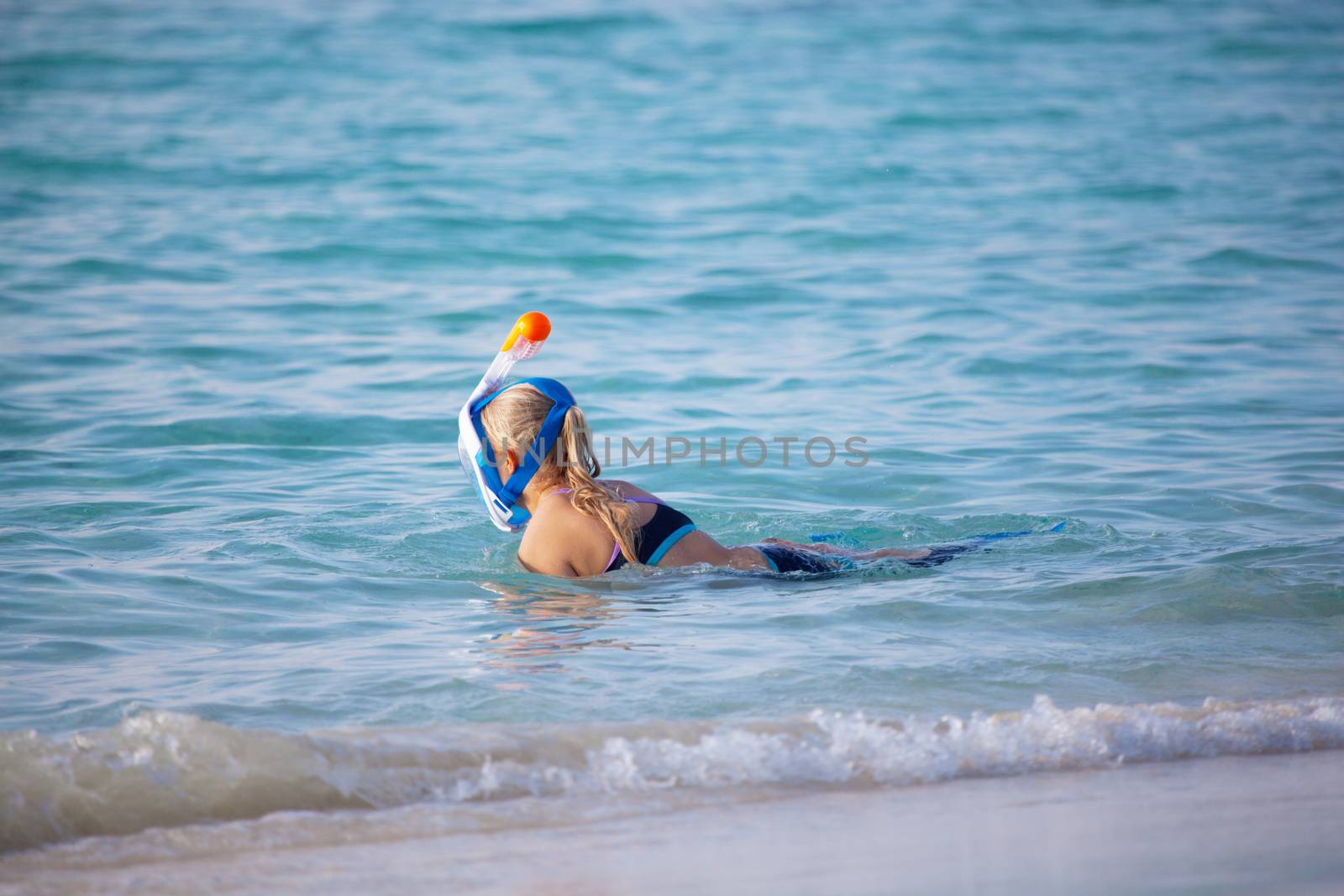 A young woman go snorkeling in the ocean