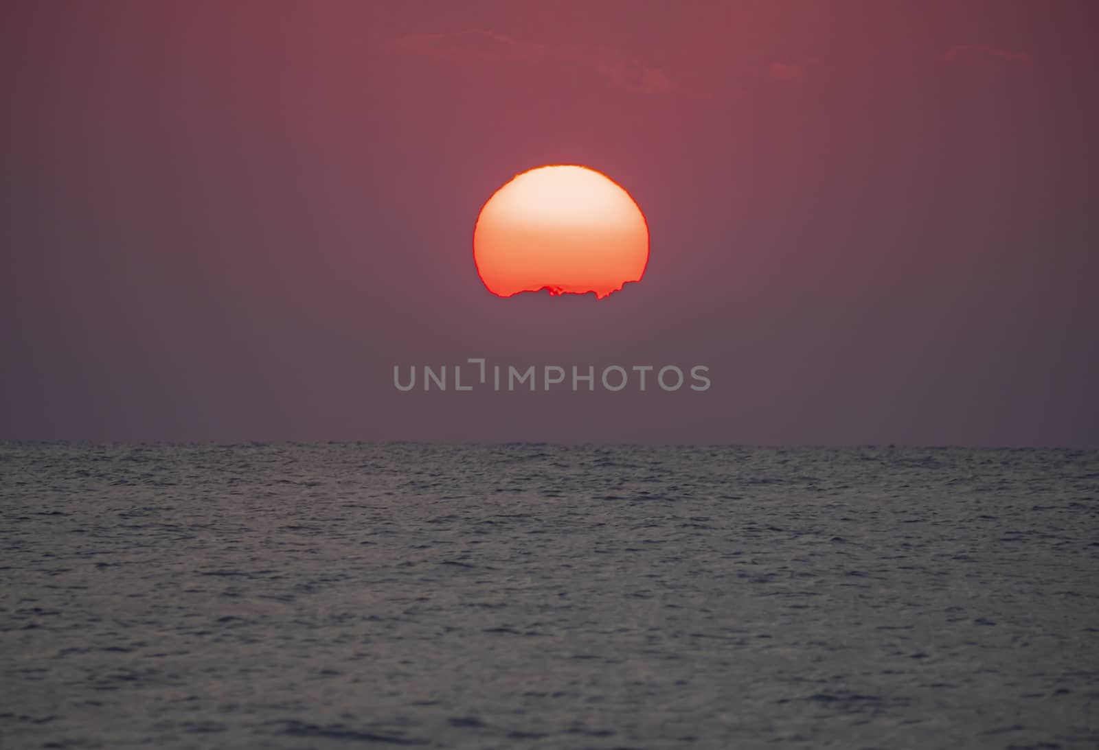 big sun down over sea sunrise, red sky