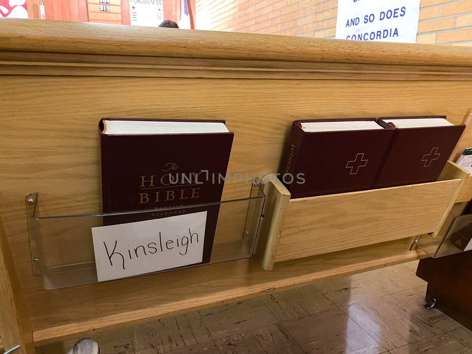 Springfield, IL/USA-10/3/20: A hymnal and bible behind a pew for the parisioner to use  for the Sunday services.