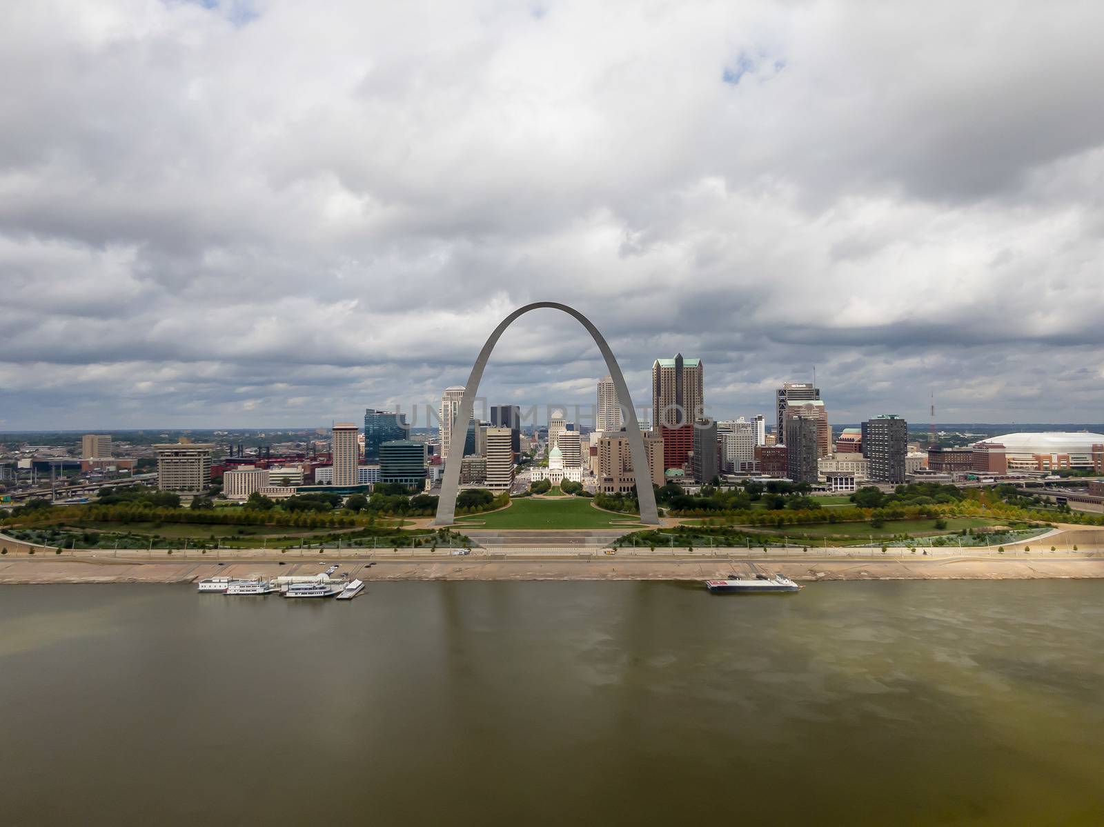 August 28, 2020 - St Louis, Missouri, USA: Aerial views of the city of St. Louis, Missouri with the St. Louis Arch and a barge on the Mississippi River