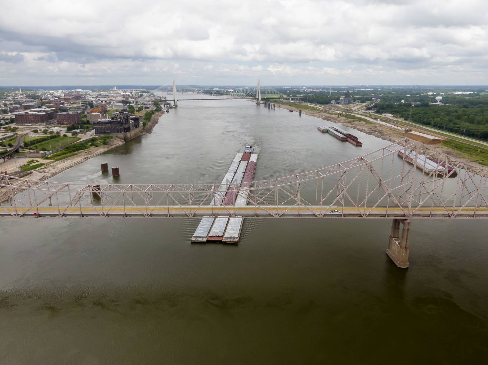 August 28, 2020 - St Louis, Missouri, USA: Aerial views of the city of St. Louis, Missouri with the St. Louis Arch and a barge on the Mississippi River