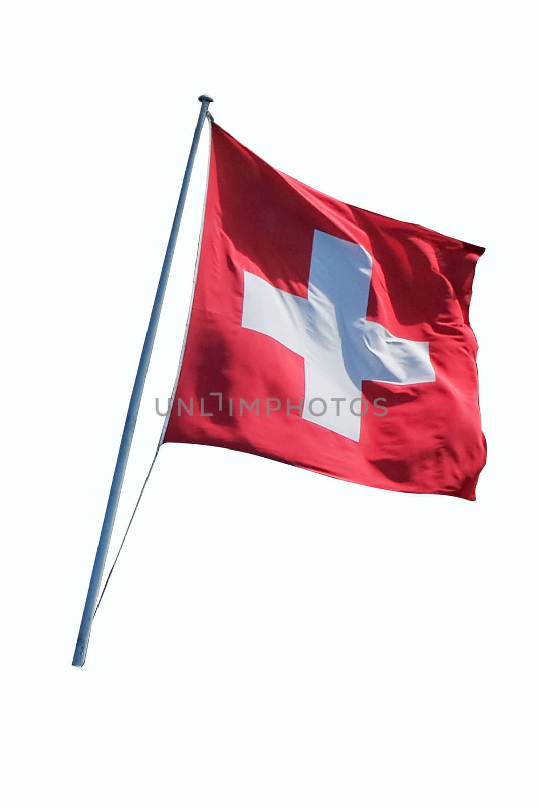 Swiss flag flying on a metal pole, isolated on a white background with clipping path 