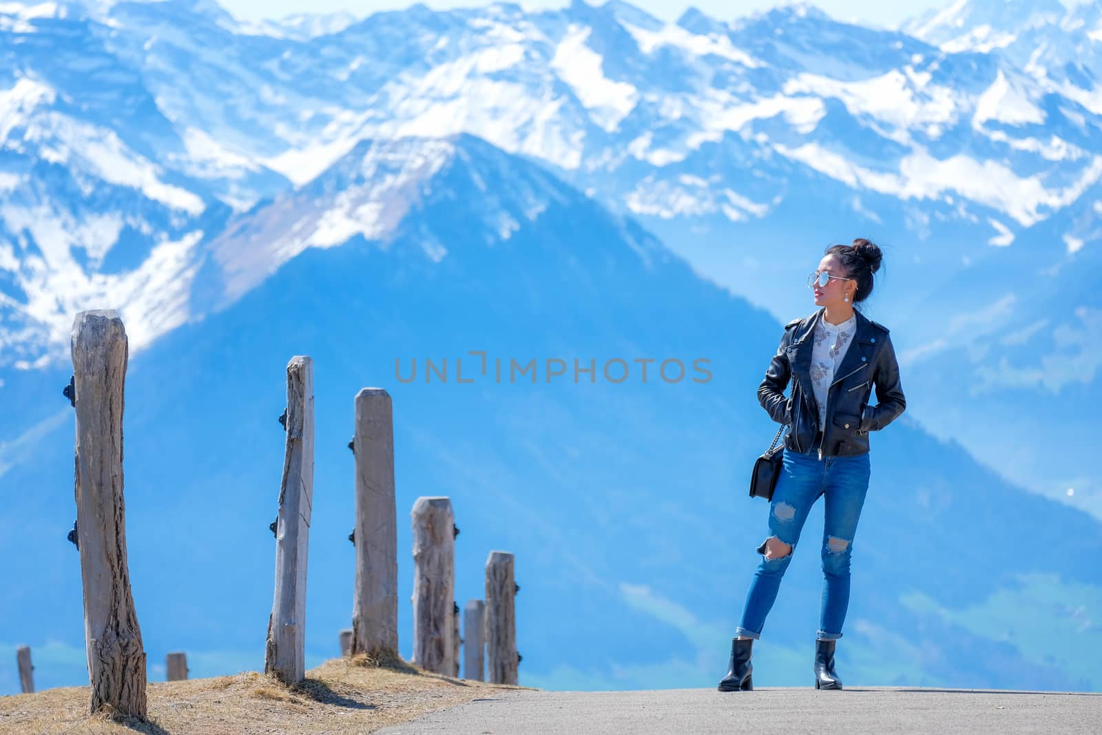 Young woman on Rigi mountain in Switzerland with a magnificent p by Surasak