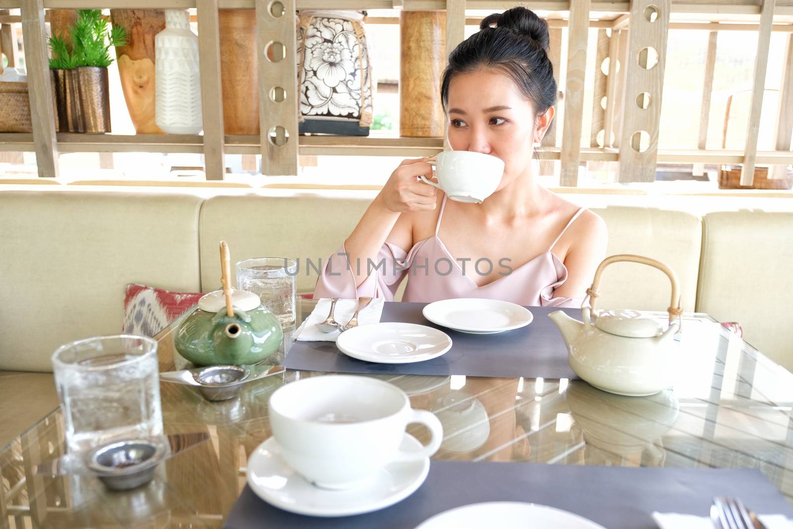 Young woman drinking tea in the morning
