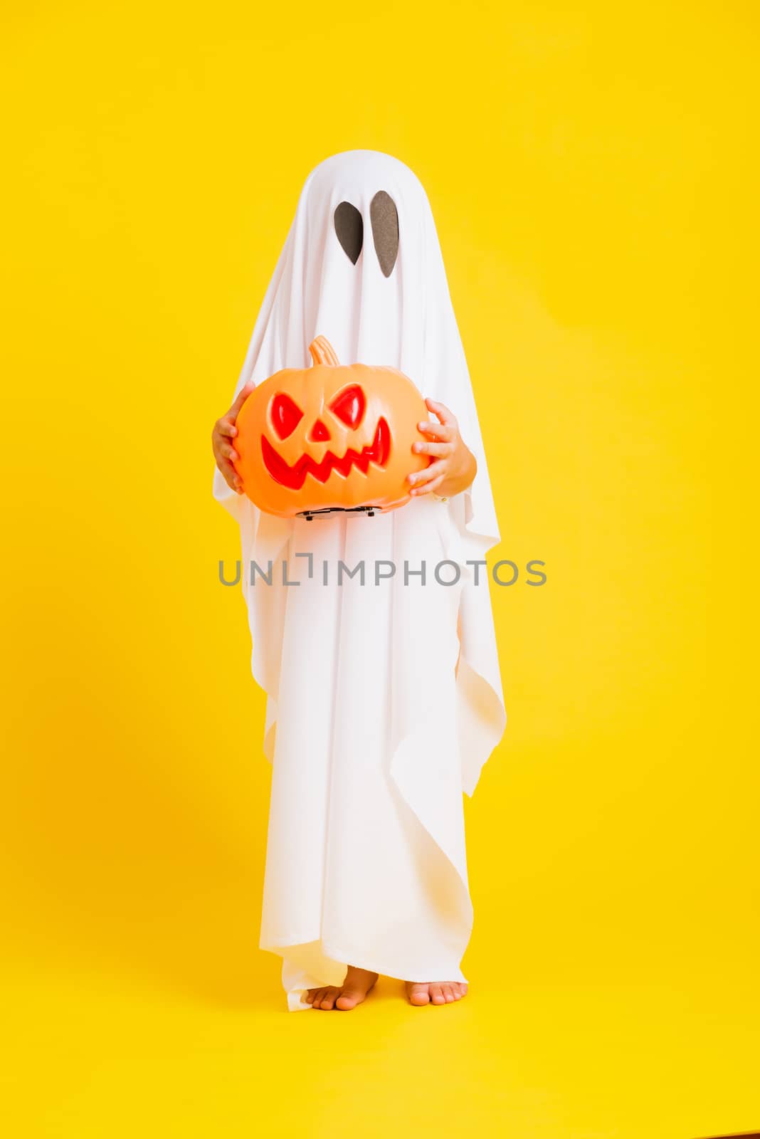little cute child with white dressed costume halloween ghost sca by Sorapop