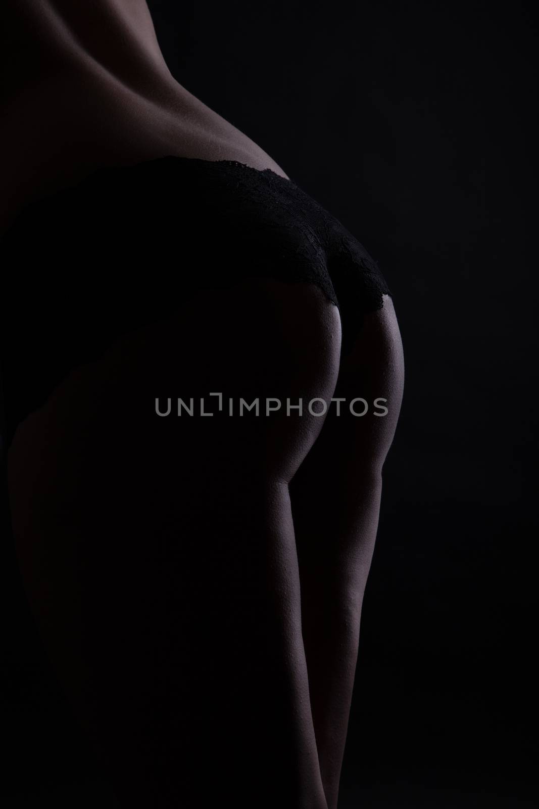 womans butt in black slip