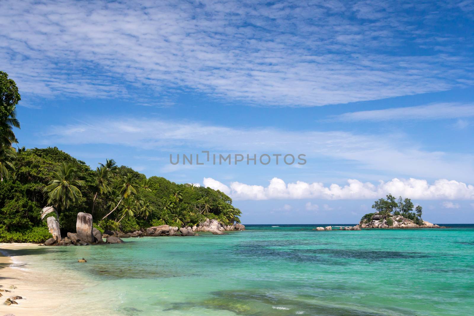 Beautiful beach with a small island in the near, Seychelles
