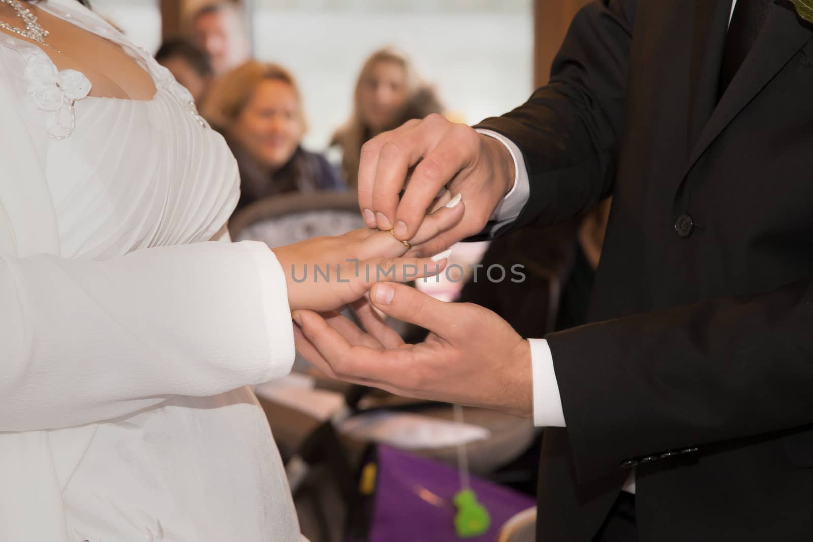 The bridal couple exchanges the wedding rings with each other