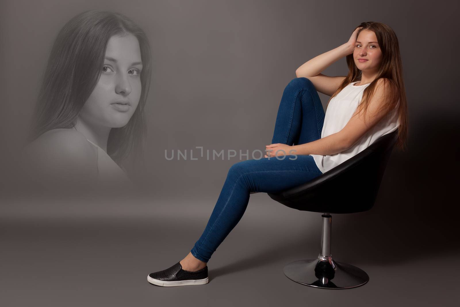 Young woman sitting on a stool with a silhouette