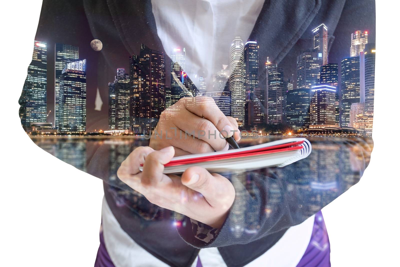 Double exposure of businesswoman  writing the word on a notebook on night cityscape background.