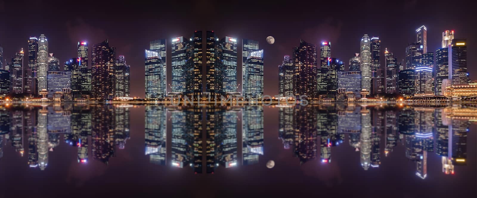 Panoramic view at night of  a megalopolis skyscrapers  with reflection  of Singapore city.