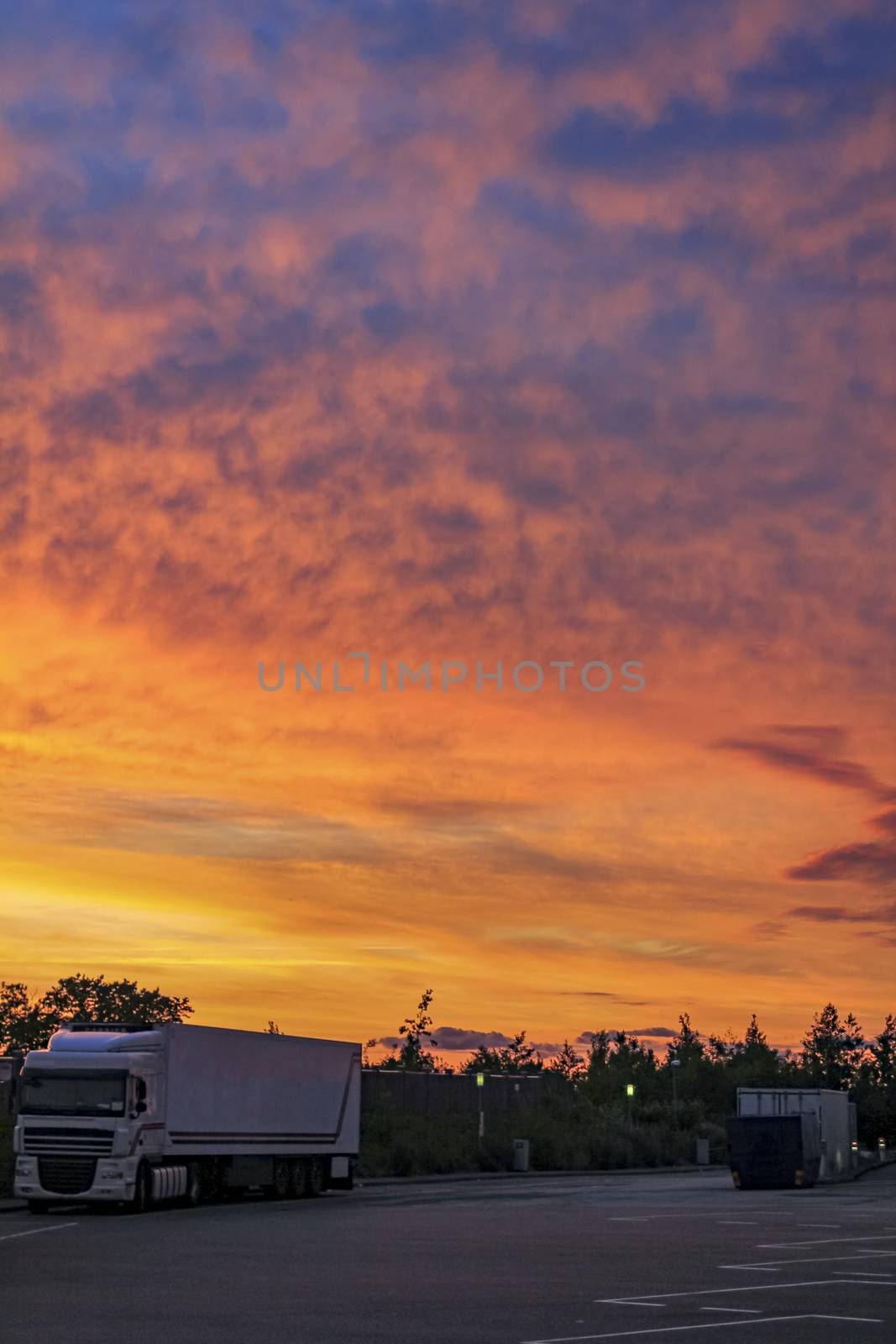 Beautiful colorful sunset with clouds somewhere in Denmark. by Arkadij