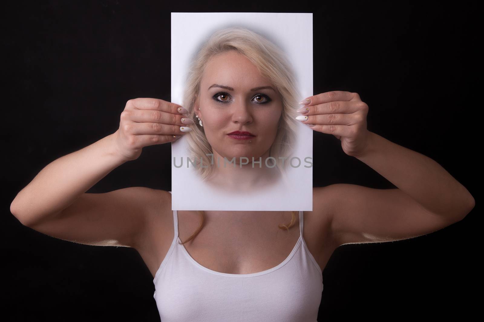 young woman holding a paper in front of face by 25ehaag6