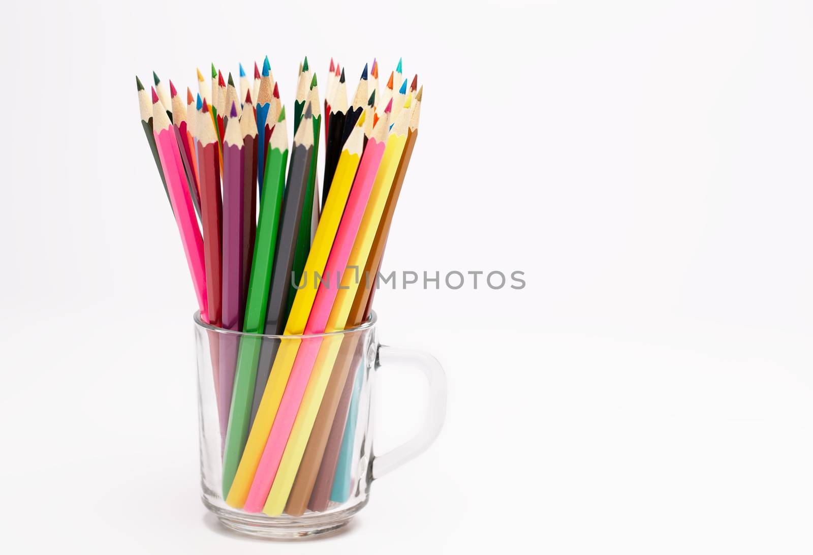 A Colorful wooden pencils stand in a pencil holder