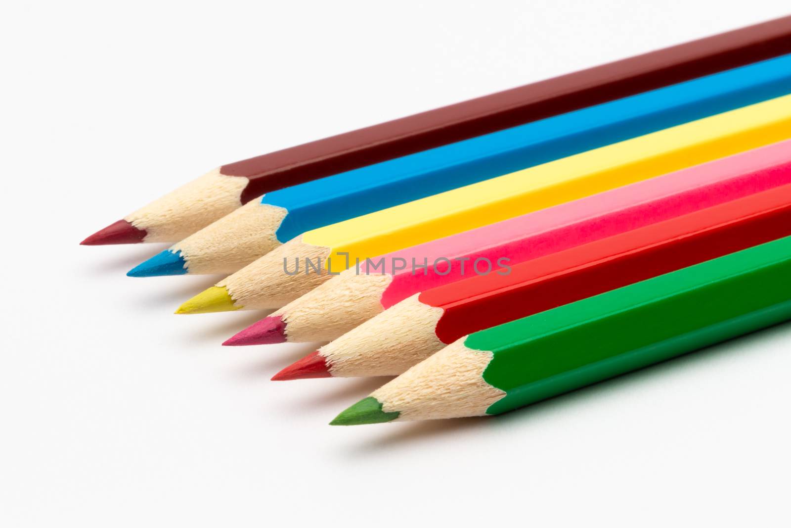 A Colorful color wooden pencils on a white background