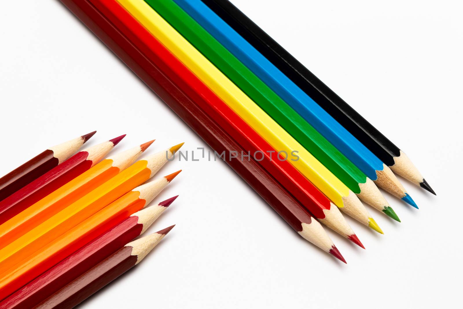 Some colorful wooden pencils on a white background